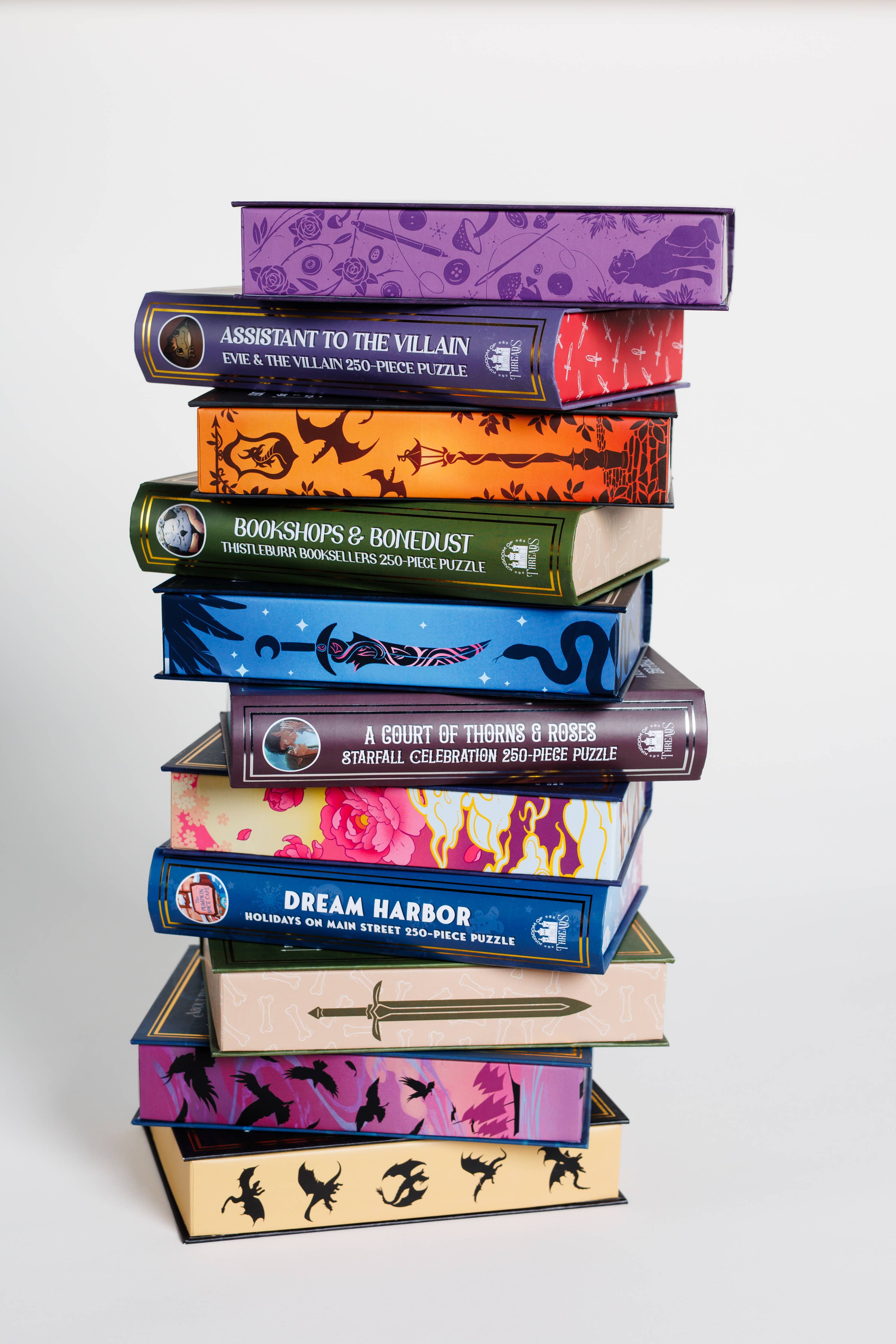 The Daughter of the Moon Goddess Keepsake Puzzle in an illustrated, book-shaped box with fantasy-themed designs.