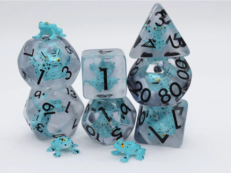 Blue Poison Frog RPG Dice Set with blue resin polyhedral dice, small blue frogs, and two frog figures on white background.