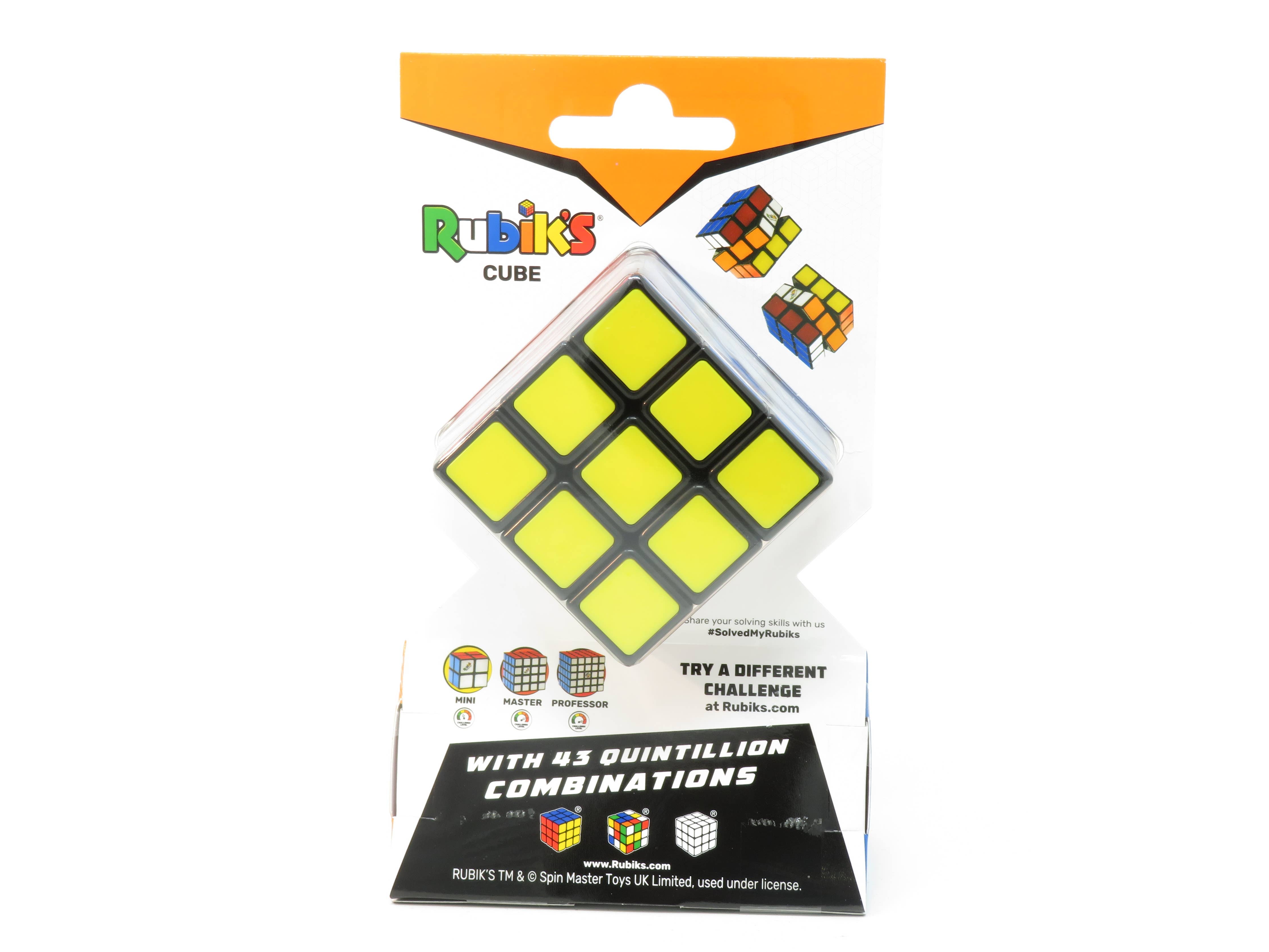 Rubiks Cube 3x3 in packaging, yellow face visible, branding and stats shown on the box.