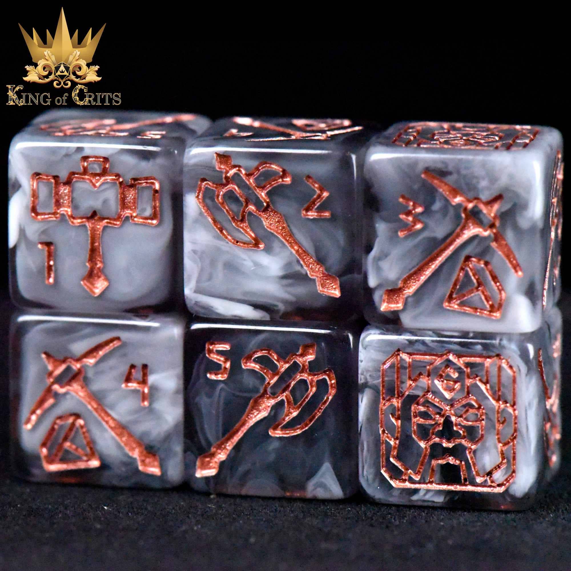 Six copper-colored dice from the Dwarven Dynasty - 11 Dice Set feature weapon designs and King of Crits logo.