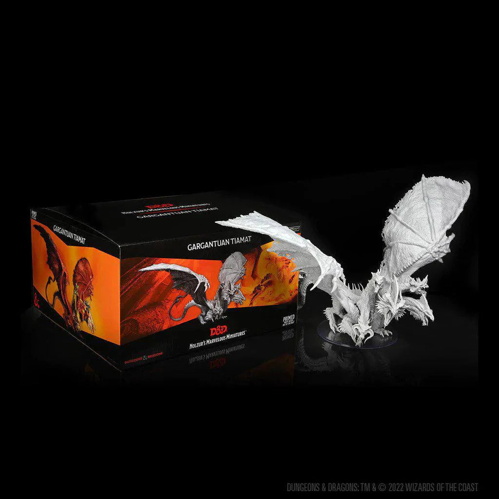 Unpainted D&D Nolzurs Marvelous Miniature W20 Gargantuan five-headed dragon next to its box.
