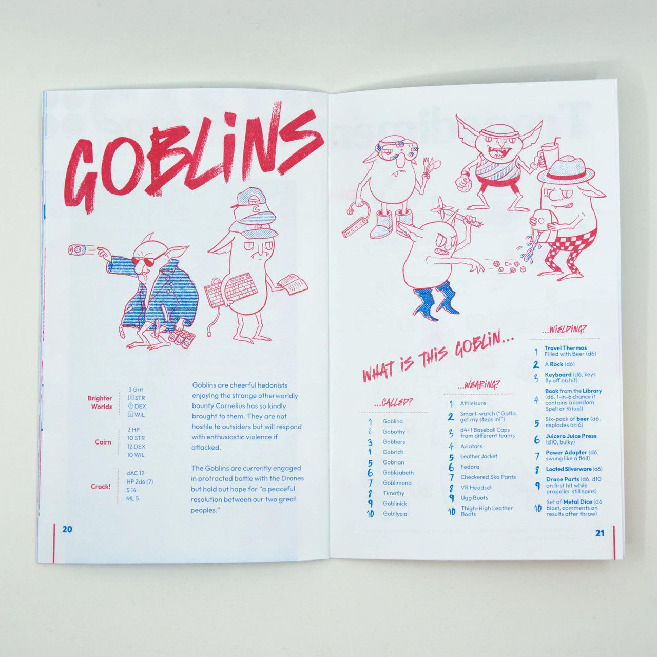 Open Wizard Trash Goblin Treasure booklet with cartoon goblins and a fantasy adventure zine showing lists and guides.