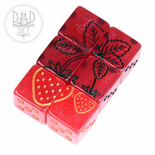 Strawberry Patch 6D6 resin dice set: four red dice arranged as a strawberry plant with leaves, DnD Dice logo shown.