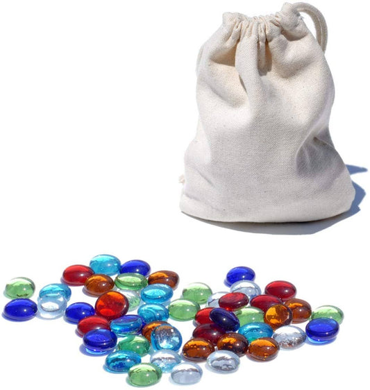 Replacement Glass Mancala Stones in assorted colors next to a beige cloth bag on a white surface.