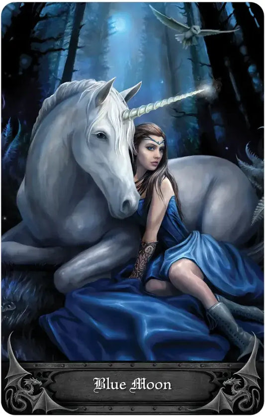 Anne Stokes Gothic Oracle card featuring a woman in blue with a white unicorn in a moonlit forest.