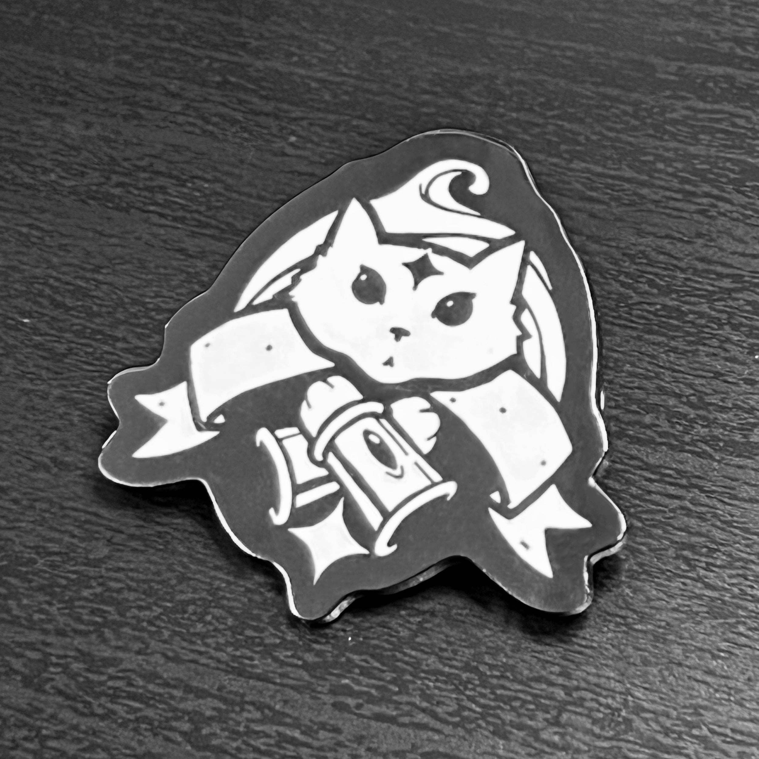 Black and white cartoon cat sticker holding a scroll.