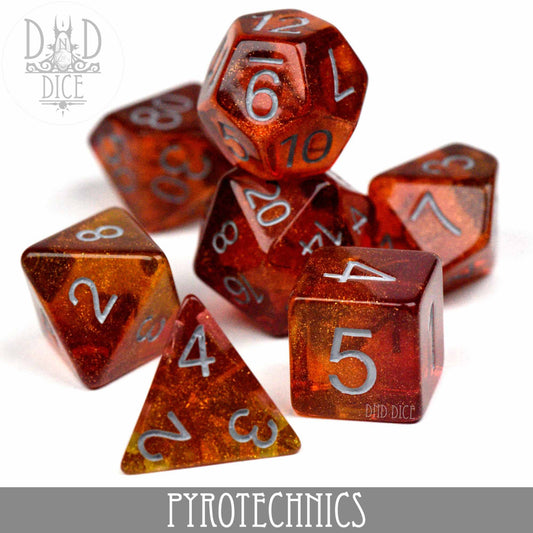 7-piece glittery red and gold resin dice set labeled PYROTECHNICS for tabletop gaming.