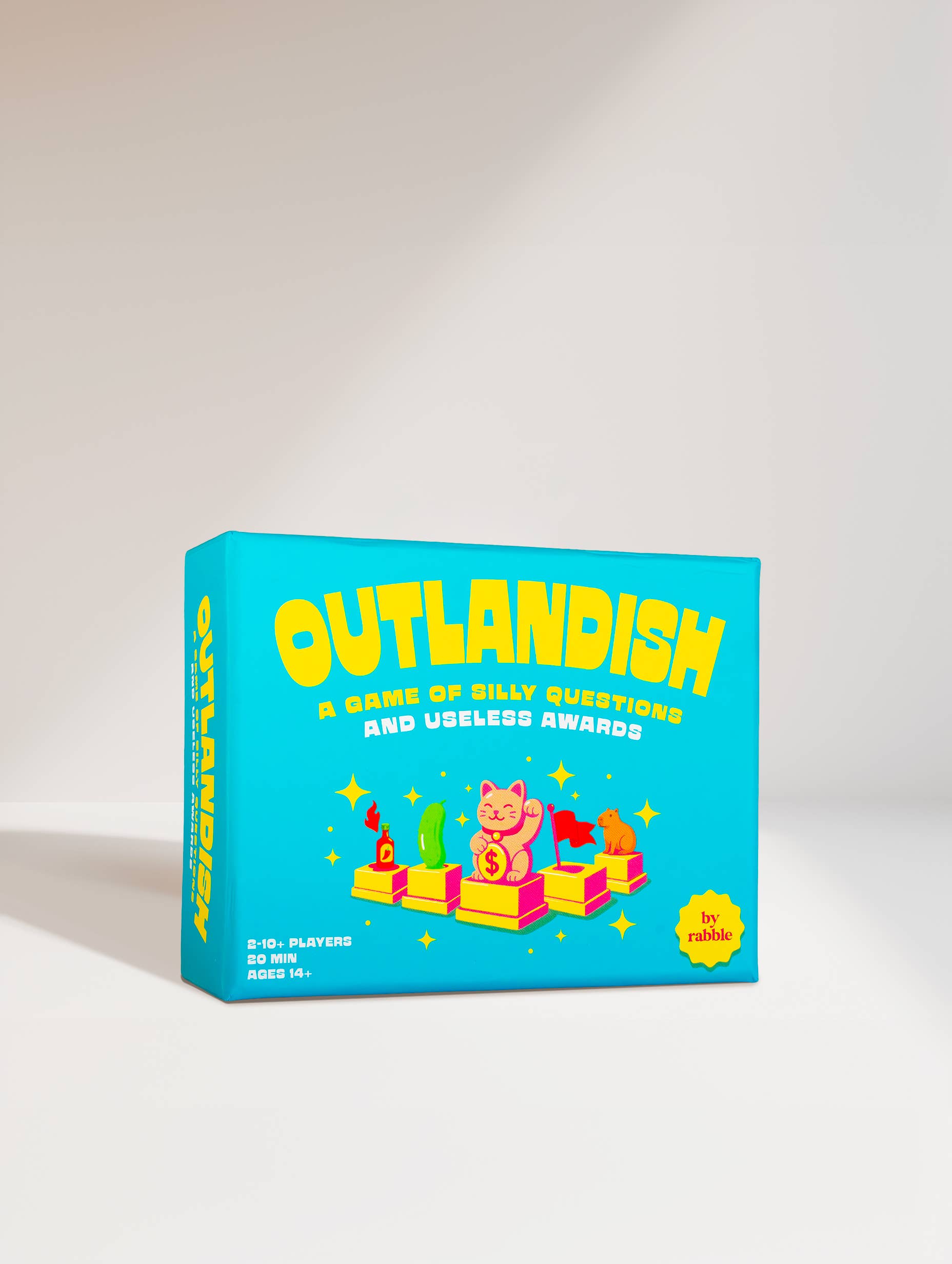 Blue box for “Outlandish - A game of silly questions and useless awards” with yellow text.