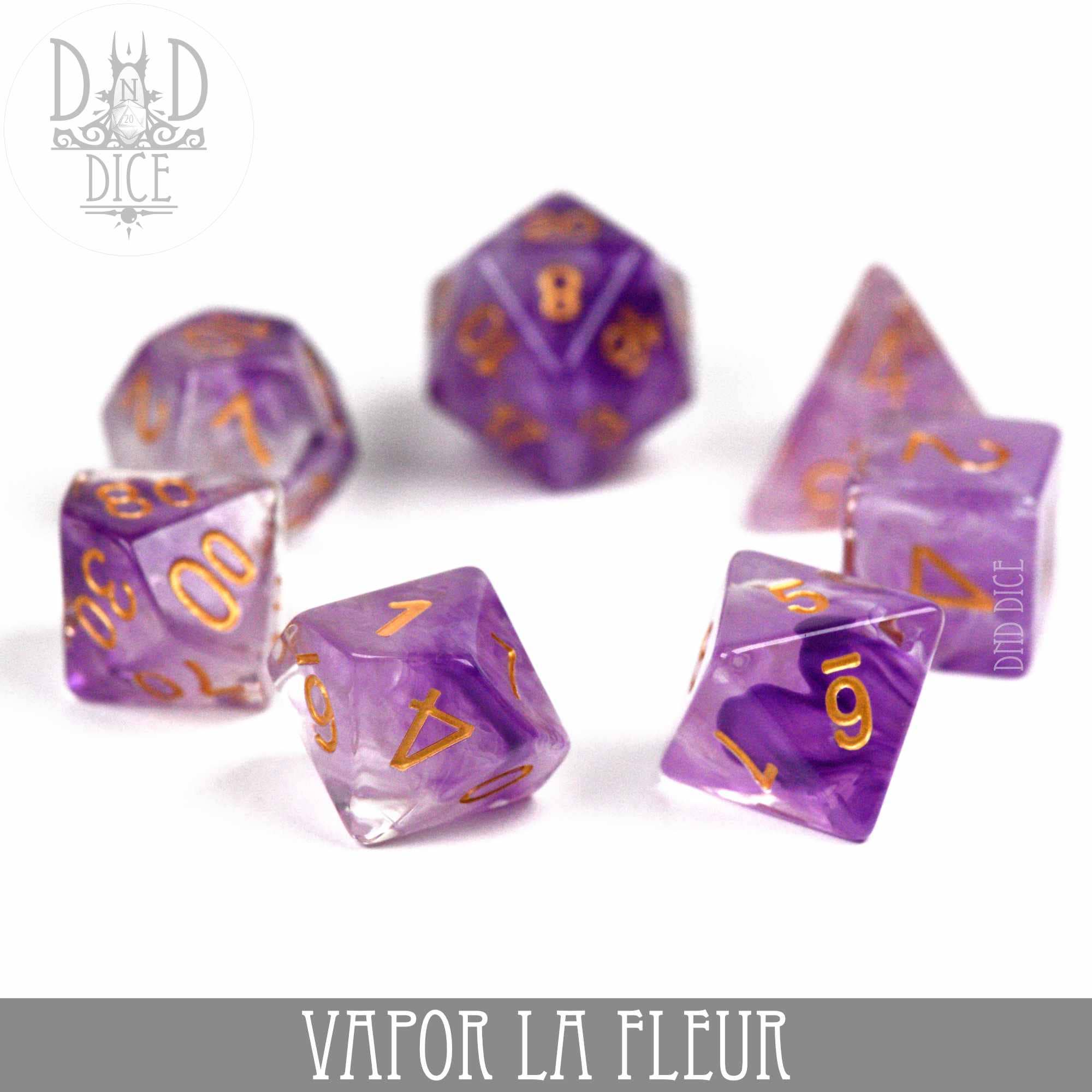 Vapor La Fleur translucent purple resin 7-dice set with gold numbers.