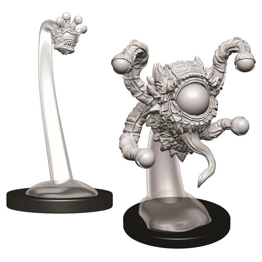 Two unpainted D&D Tiefling Male Sorcerer miniatures on black bases.