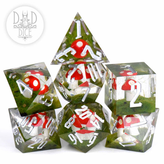 Turf and Toadstools (Handmade) 7-dice set in clear resin with red and white mushroom designs for tabletop gaming.
