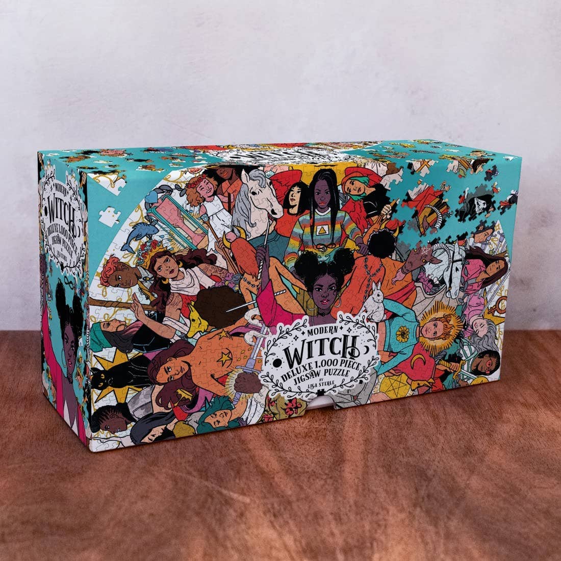 Modern Witch Deluxe 1,000 Piece Jigsaw Puzzle by Lisa Sterle in box featuring magical, diverse women.