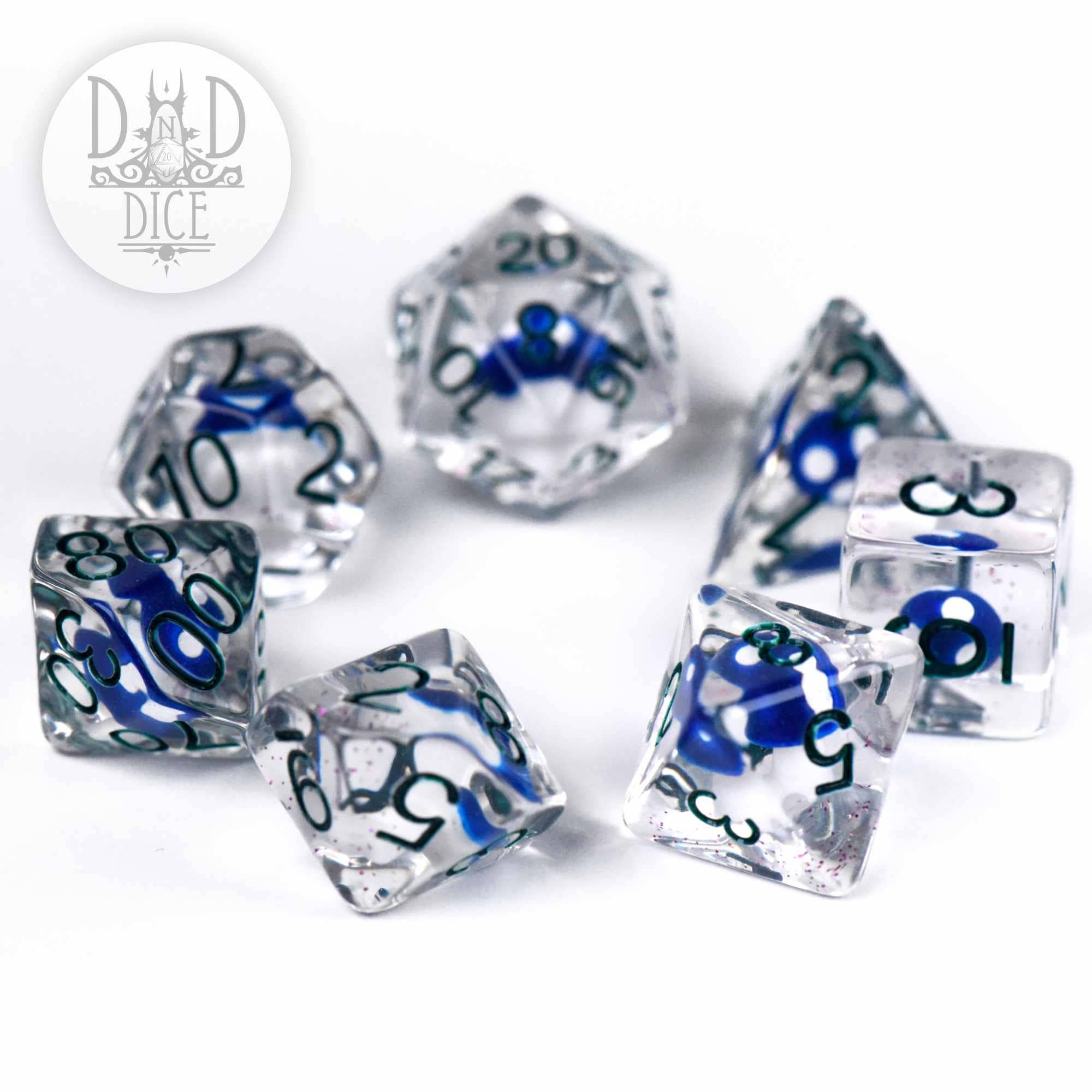 “Fungal Spores” 7-dice DnD set, clear resin with blue swirls and numbers, on white surface.