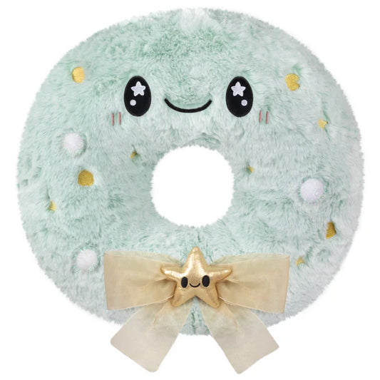 Squishable Flocked Wreath, a plush mint green donut with gold dots and a bow.