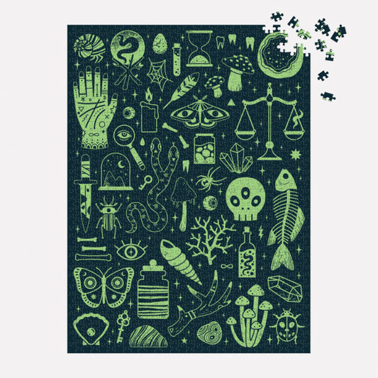 Occult and Curious 1000 Piece Glow in the Dark Puzzle with mystical icons on a dark background.