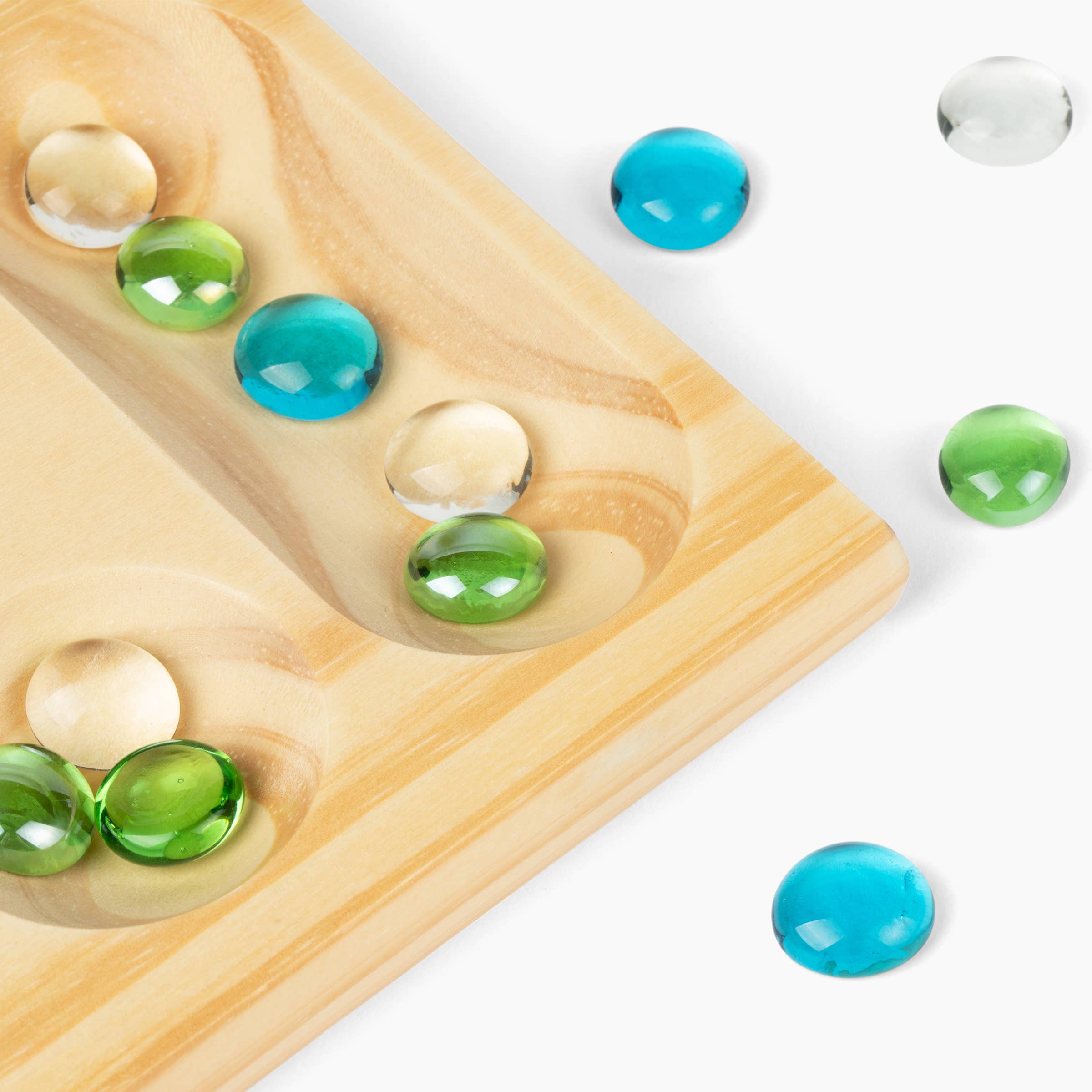 Canvas Classics Mancala folding wooden board with blue, green, and clear stones.