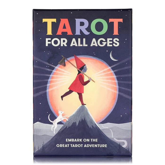 Tarot for All Ages Deck box featuring artwork of a figure and cat hiking up a mountain under sun and moon.