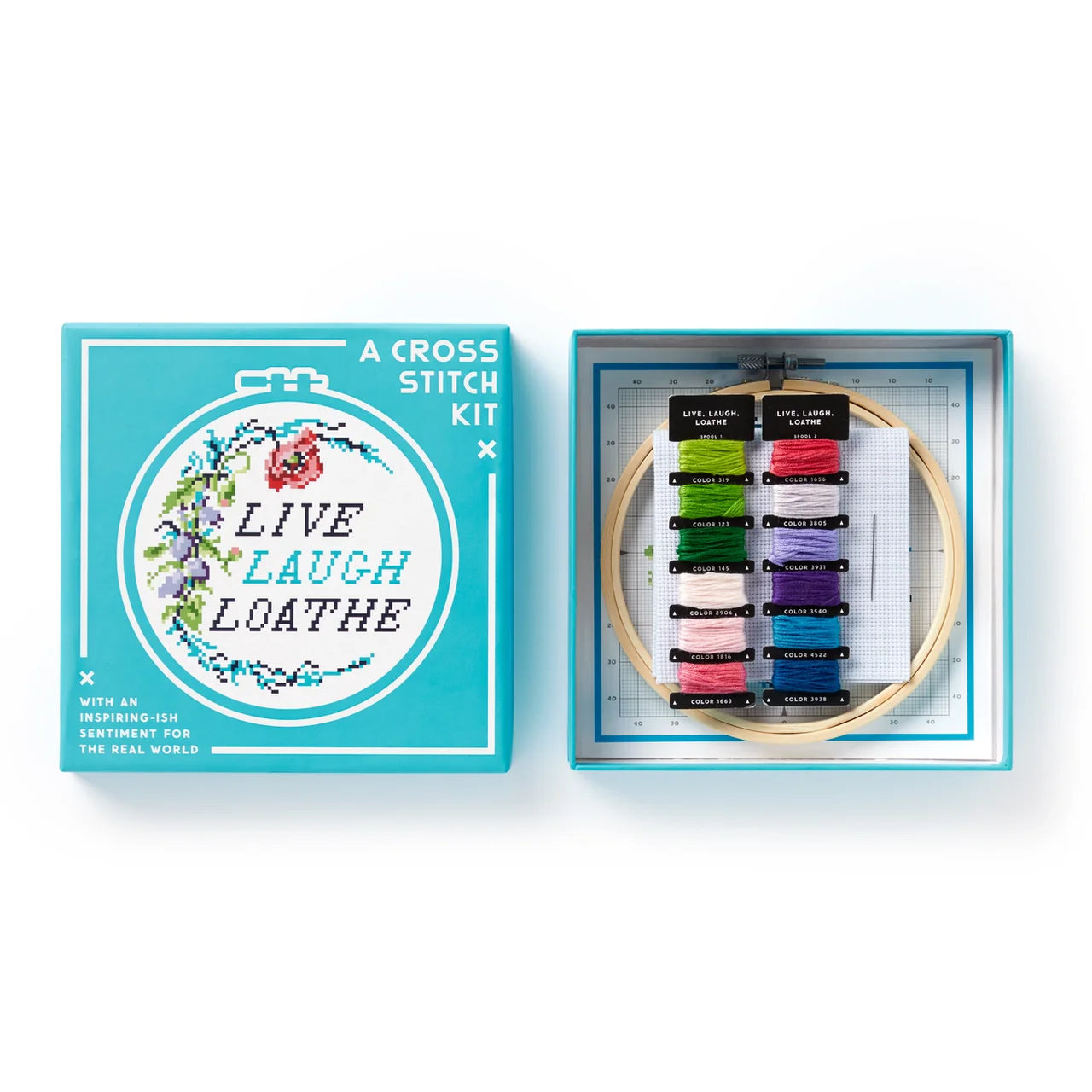 Live Laugh Loathe Cross Stitch Kit for beginners with floral pattern, hoop, and thread in blue box.