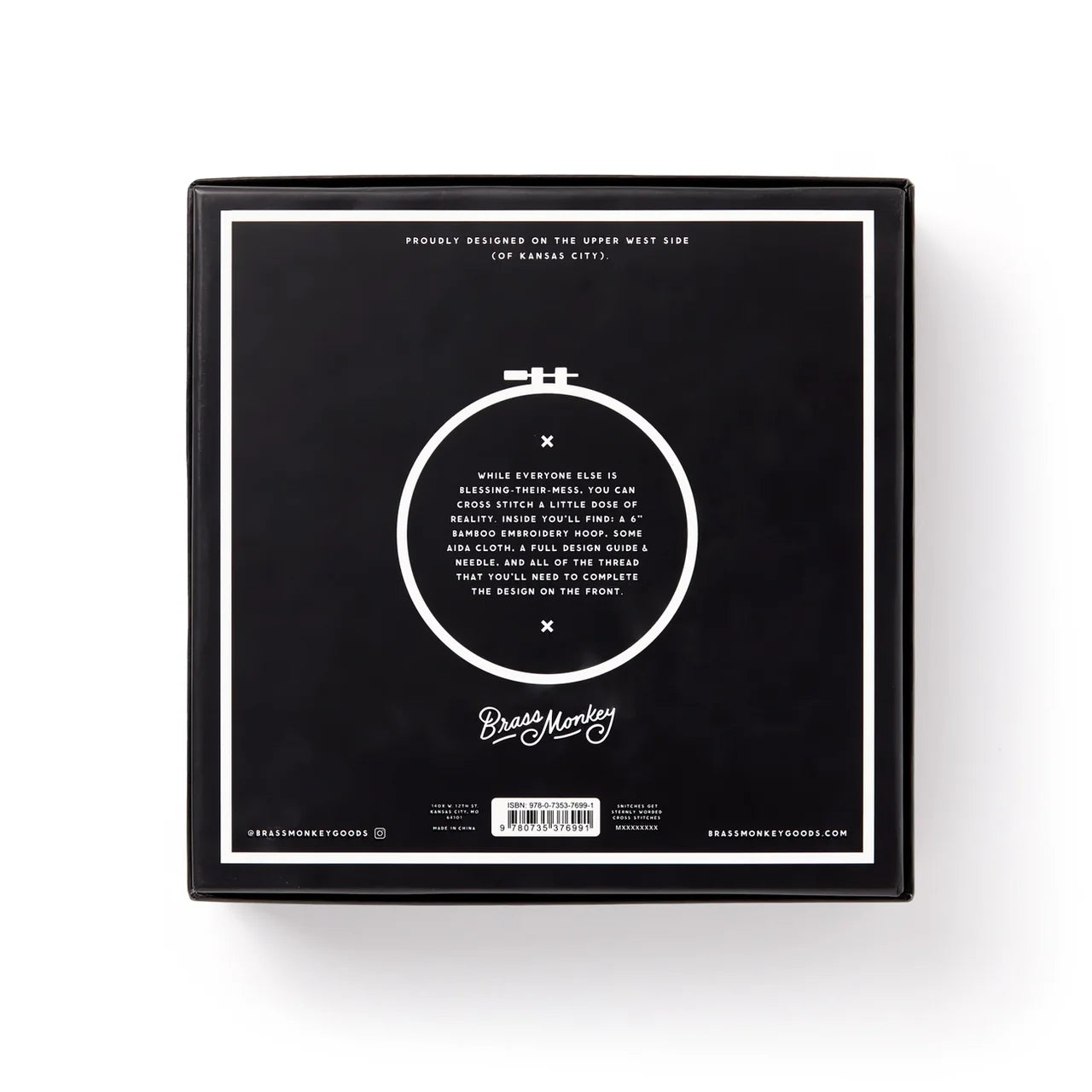 You Light Up A Room Cross Stitch Kit with black box, white text, and circular embroidery hoop.