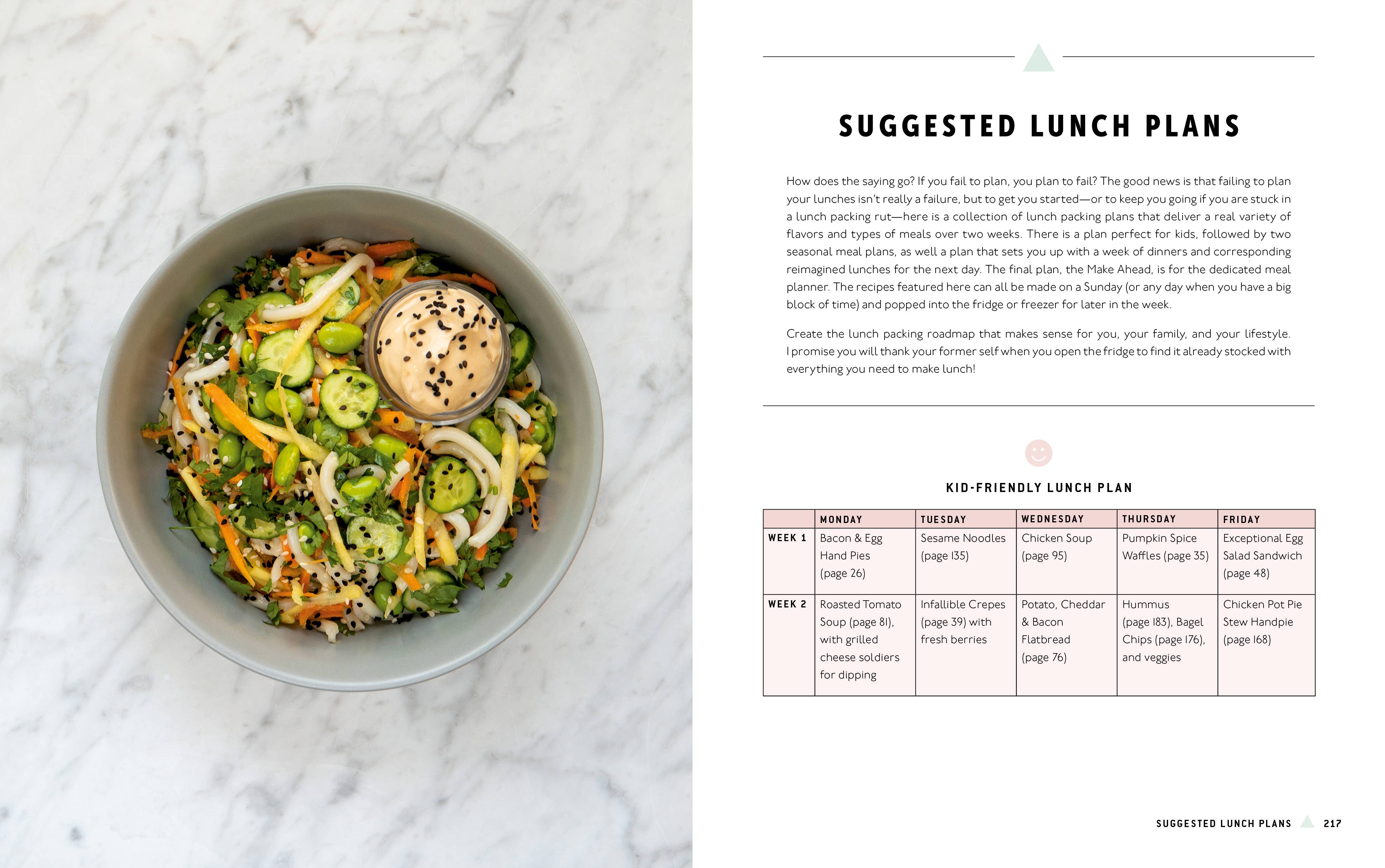 Lunchbox: 75+ Easy & Delicious Recipes book next to a salad with dip.