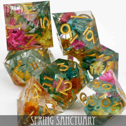 Handmade Spring Sanctuary dice set with colorful resin, gold numbers, and vibrant dried flowers.