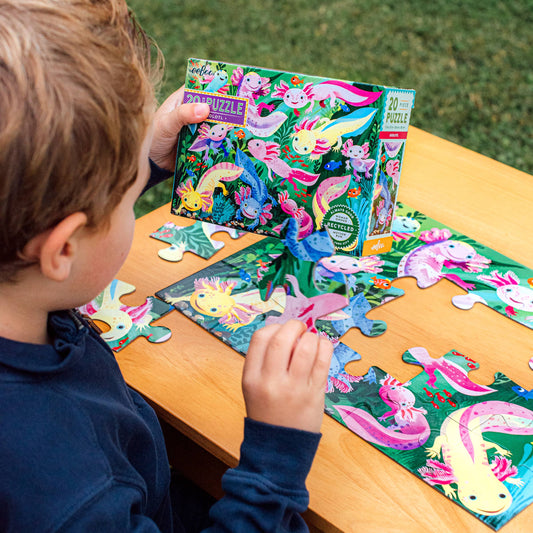 Axolotl 20 Piece Puzzle with jumbo pieces being assembled on a wooden table.
