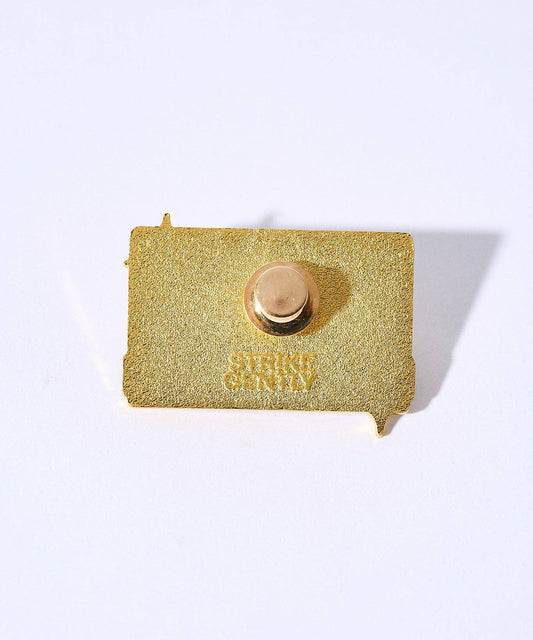 Gold-plated Sad Songs Pin back with embossed text and clasp.