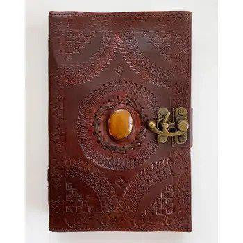 Handmade leather journal with embossed patterns, amber stone detail, and brass clasp, Flower Garden variant.