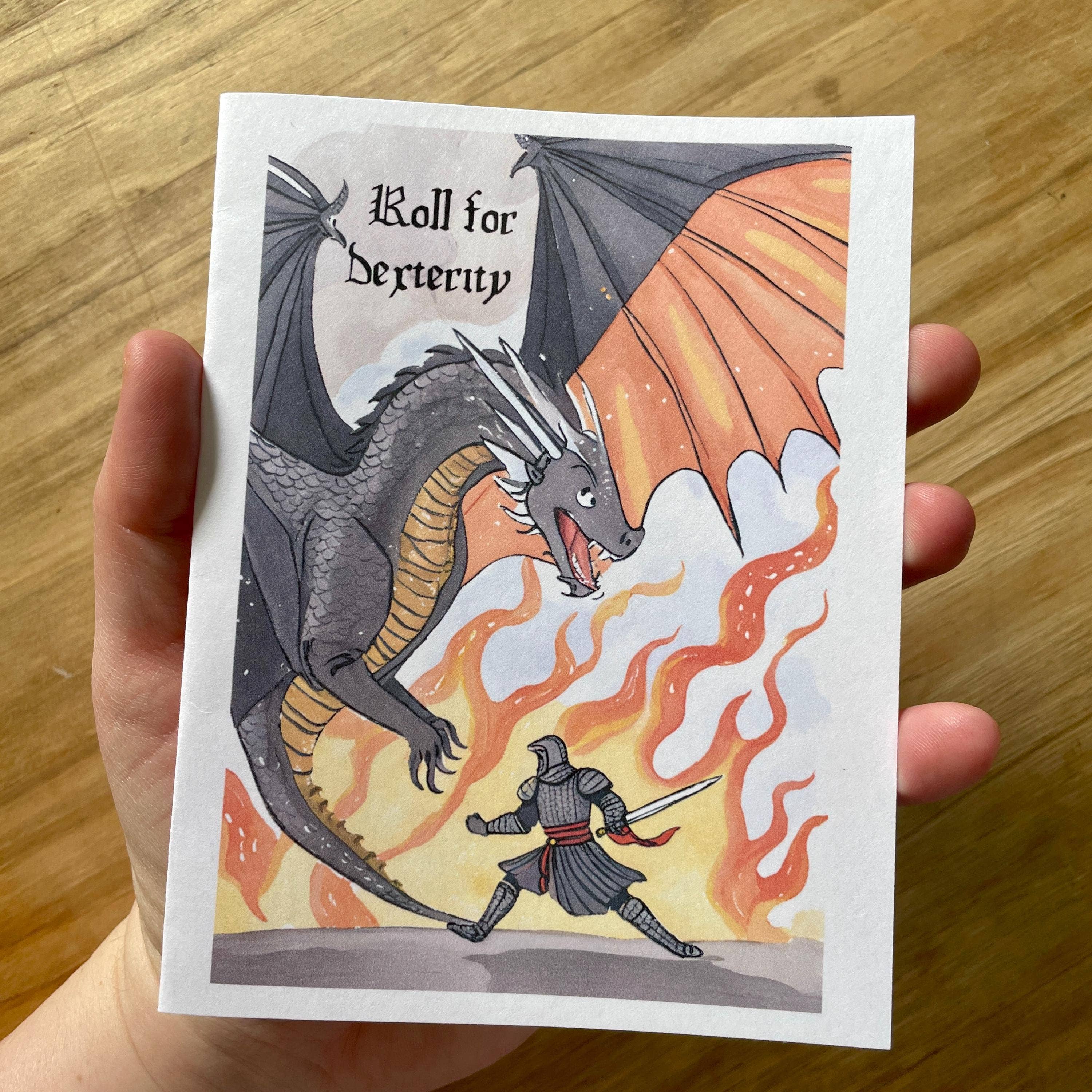 Medieval Knight and Dragon encouragement card with Roll for Dexterity text, flames, blank inside, matte card stock.
