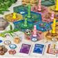 Takenoko board game components: hexagonal tiles, player pieces, cards, and tokens on a table.