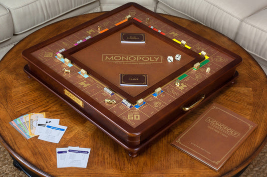 Monopoly Luxury Edition board game with gold tokens and cards.