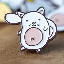 Cat Enamel Pin TCGCP featuring a round white cat with pink belly and raised paw.
