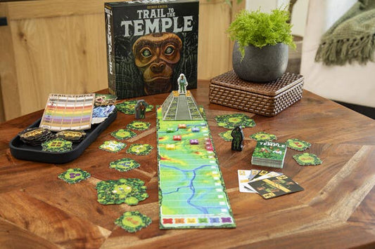 Trail To The Temple board game by Reiner Knizia, with cards and pieces arranged on a wooden table.