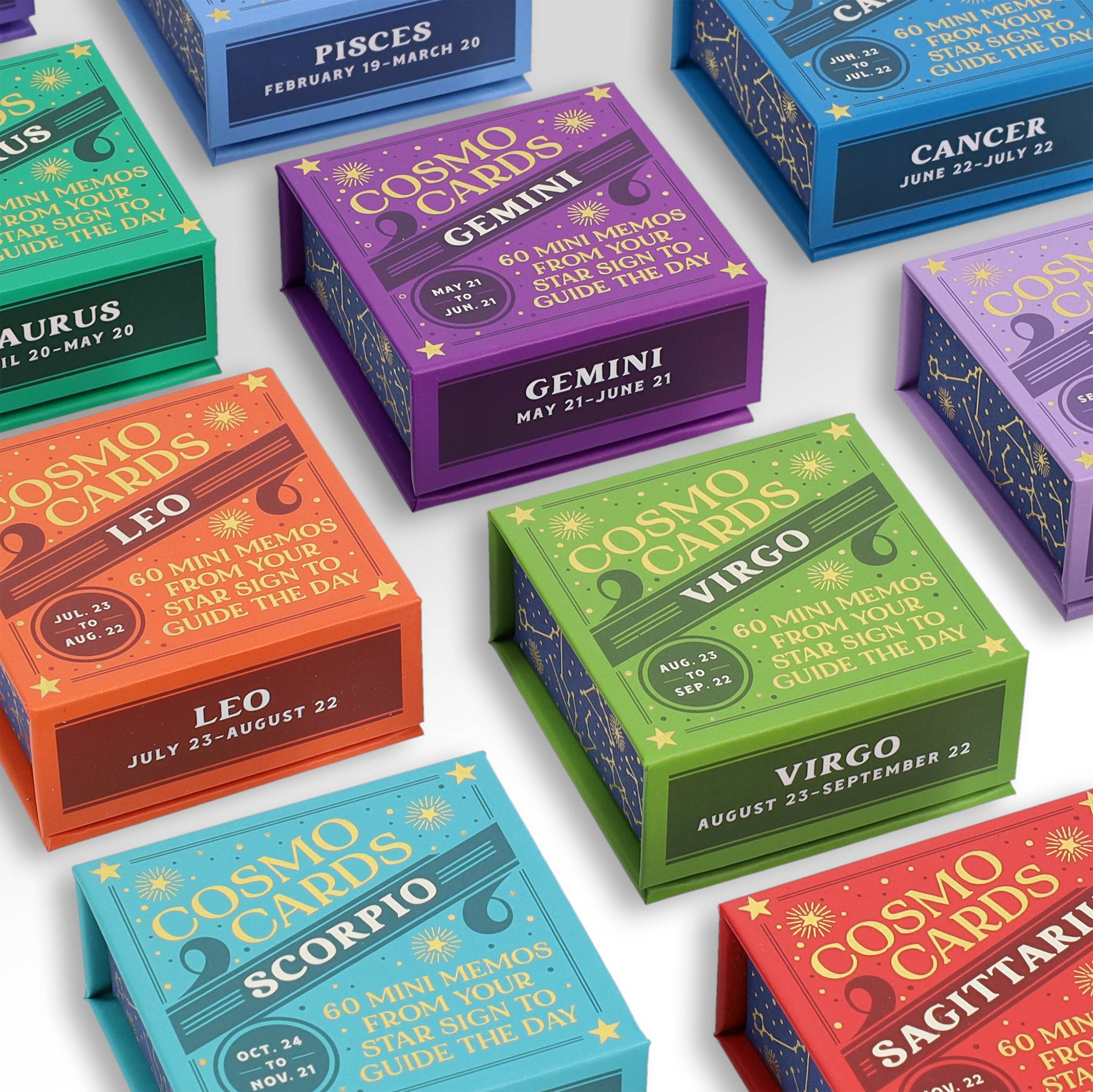 Cosmo Cards astrological guidance decks displayed in a grid on a light background.