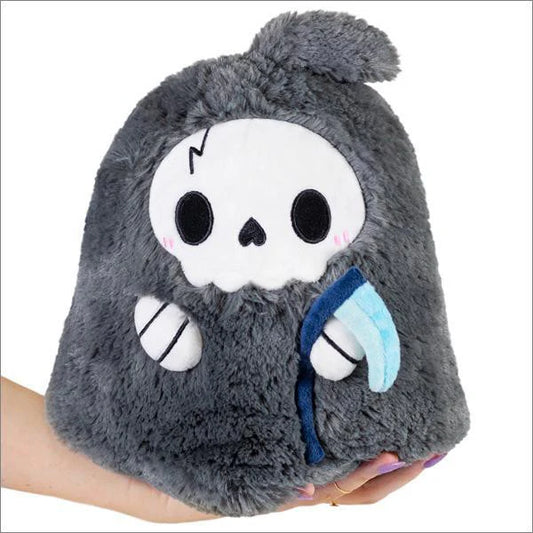 The Mini Reaper (7) is a gray plush toy shaped like a cartoon Grim Reaper holding a blue scythe.