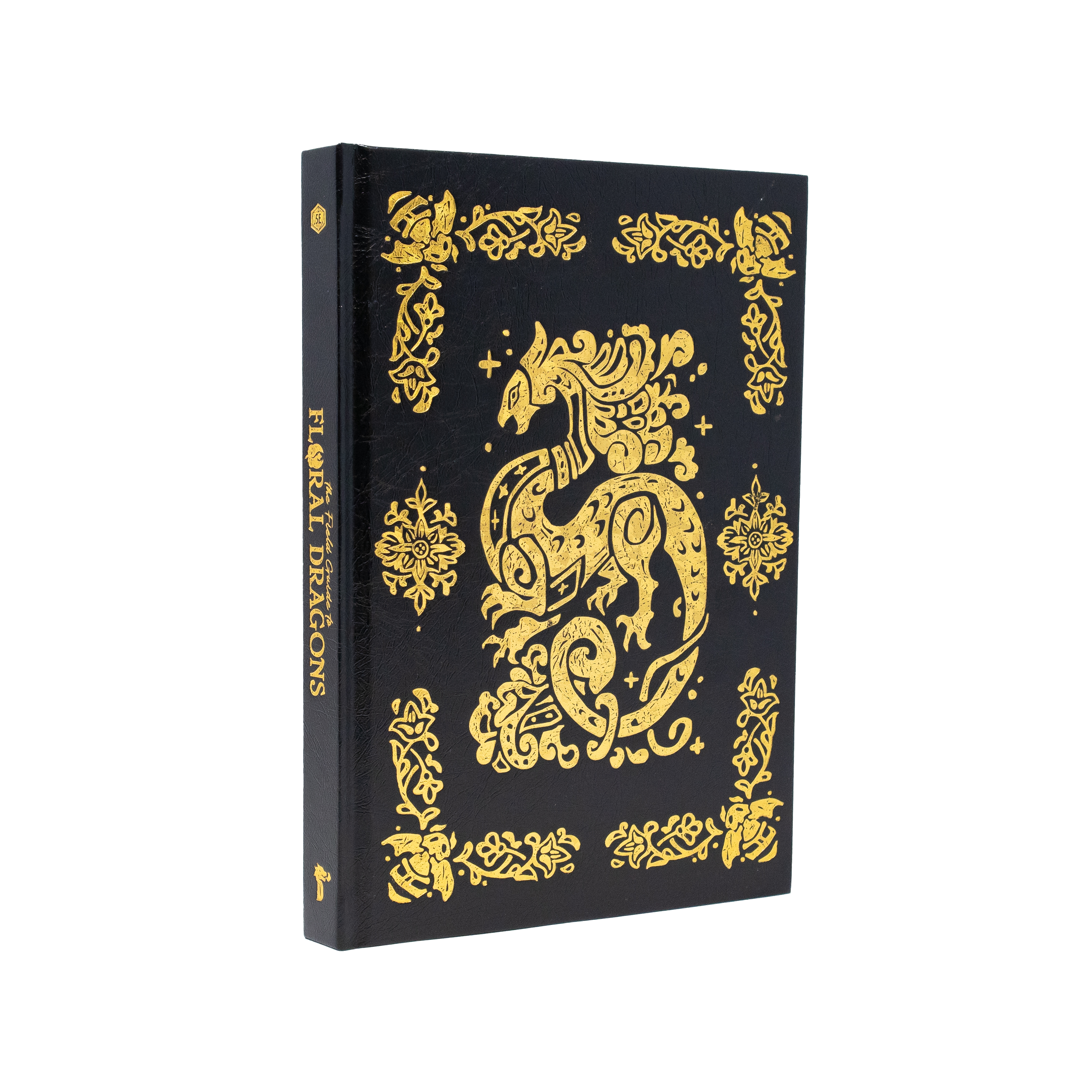 The Field Guide To Floral Dragons deluxe hardcover with gold dragon designs on a black cover.