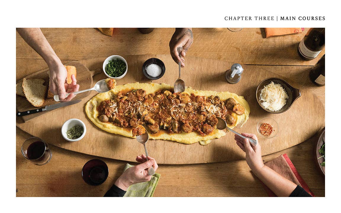 Fantastic Fungi Community Cookbook featured as four people share polenta, stew, and mushrooms.