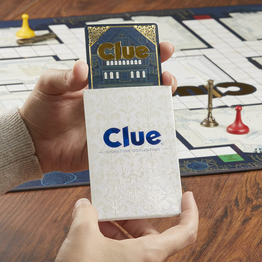 Hands holding Clue Signature Collection cards with game board and pieces visible.
