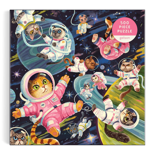 A Space Meowdyssey 500-piece puzzle featuring cats in astronaut suits in a colorful space scene.