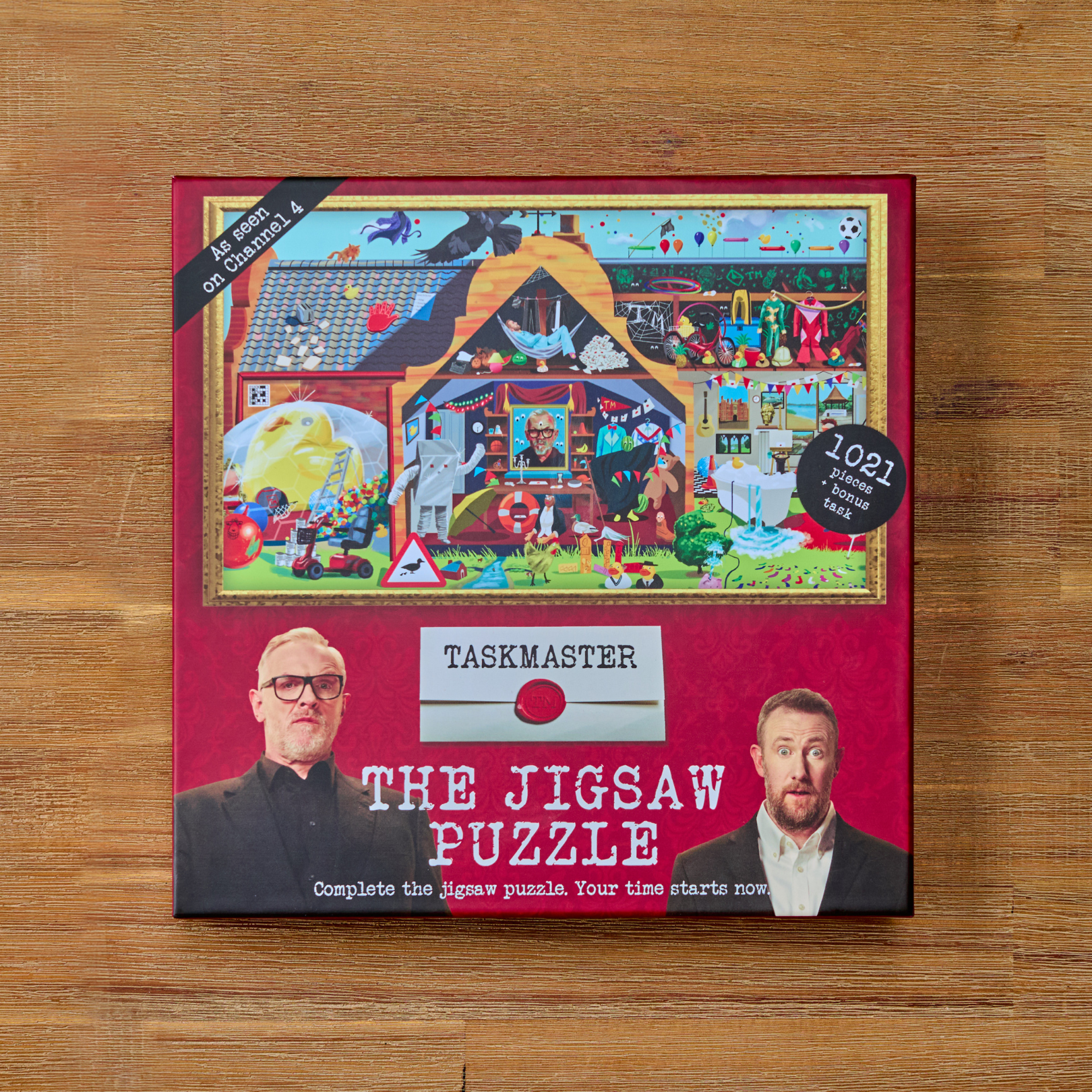 Taskmaster Jigsaw Puzzle (1021 pieces) with Secret Task, box shows cartoon house and two mens photos.