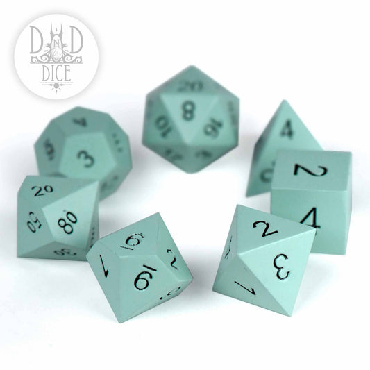 Synth Lab (Metal) 7-dice set, light blue with black numbers, shown on a white surface.