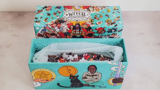 Modern Witch Deluxe 1,000 Piece Jigsaw Puzzle by Lisa Sterle in box labeled Witches, featuring diverse artwork.