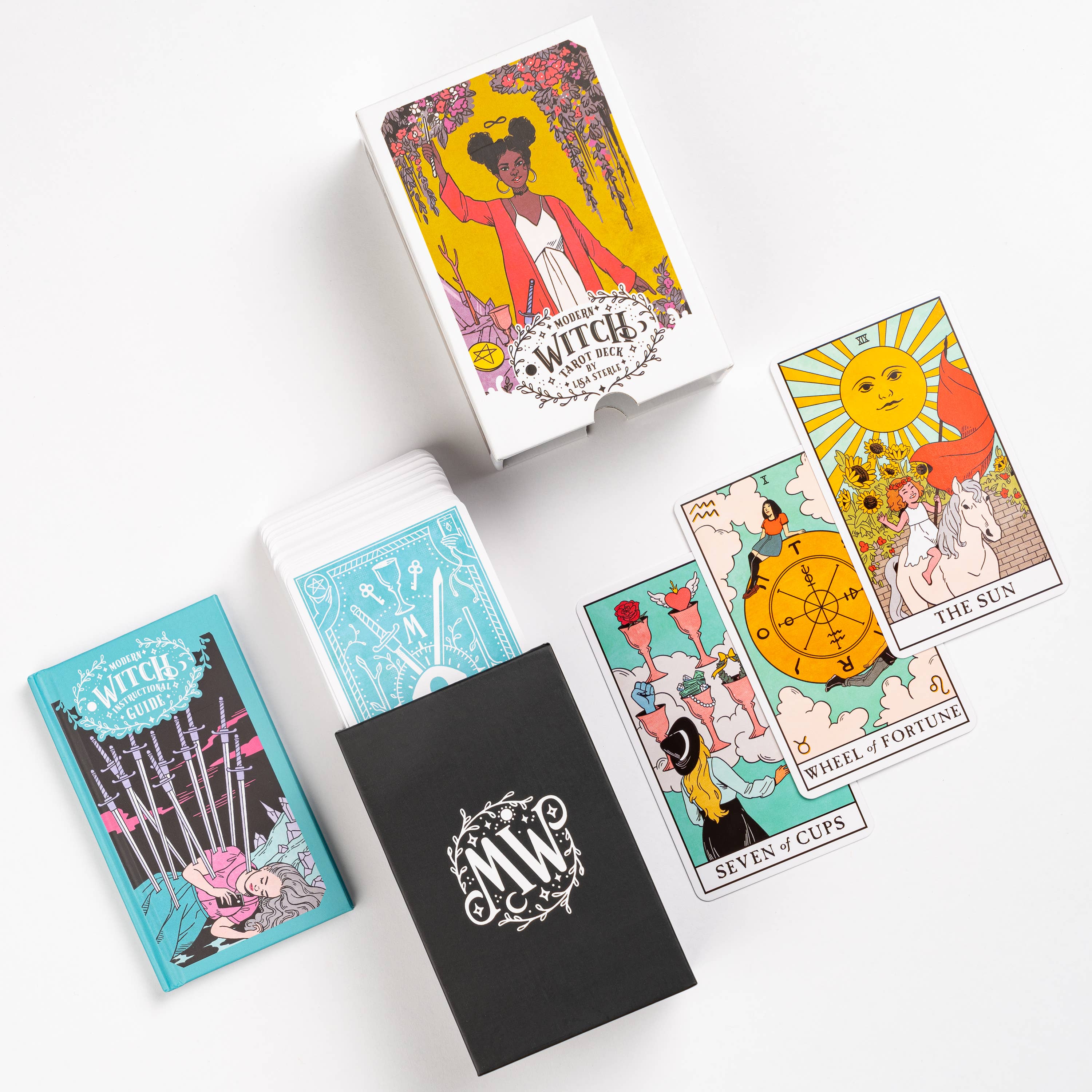 Modern Witch Tarot Deck with 3 colorful cards, illustrated guidebook, and decorative box.
