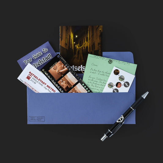 Blue envelope containing Hunter documents, postcards, metro guide, photos, and black pen.