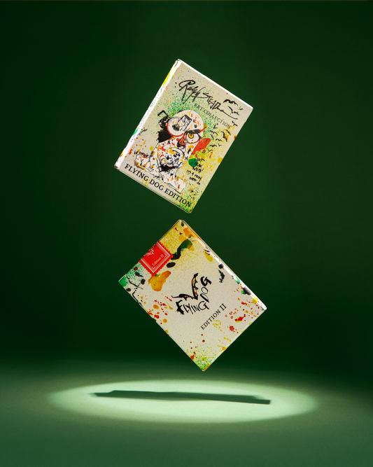 Two decks of Flying Dog Edition 2 playing cards with paint-splattered covers.