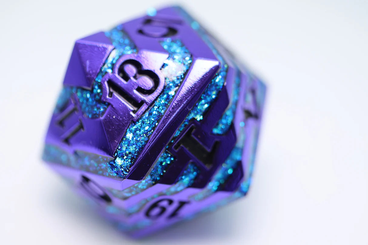 35mm Metal D20 die in Purple with Blue Mica, number 13 visible on top face.