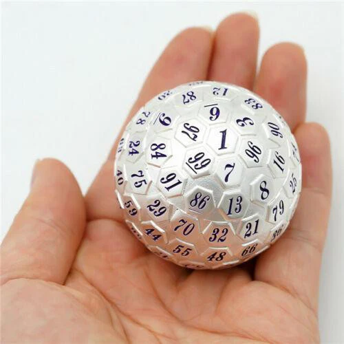 Silver 100-sided die with black numbers held in a hand.