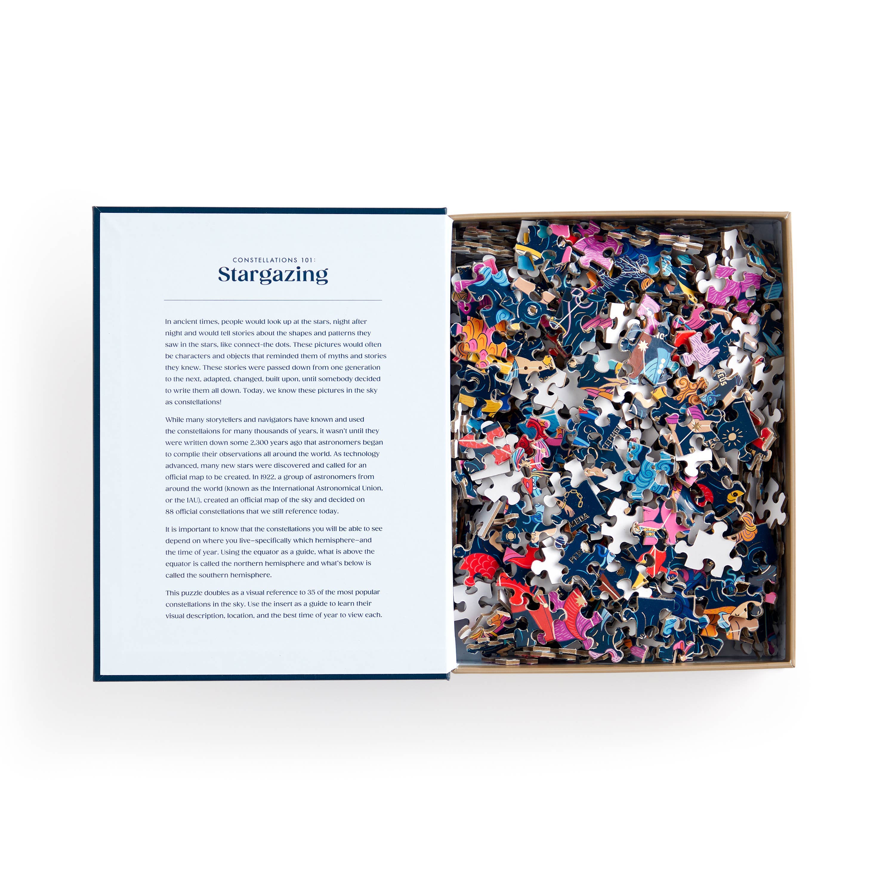 Open box of Constellations 101: Stargazing 500 Piece Book Puzzle with pieces and description sheet visible.