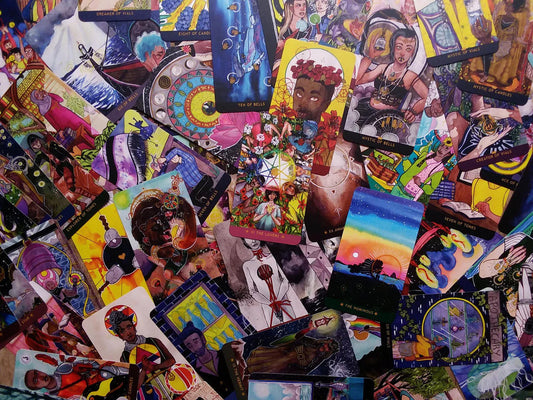 The Numinous Tarot by Cedar McCloud deck with diverse, colorful cards depicting inclusive characters.