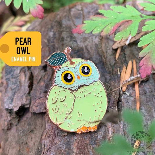 Light green pear owl enamel pin with a stem and leaf on its head.